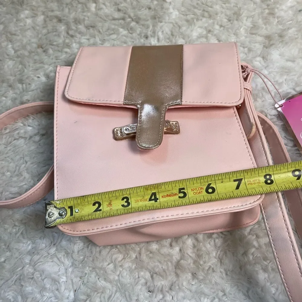 Juicy Couture pink and gold synthetic leather crossbody bag.